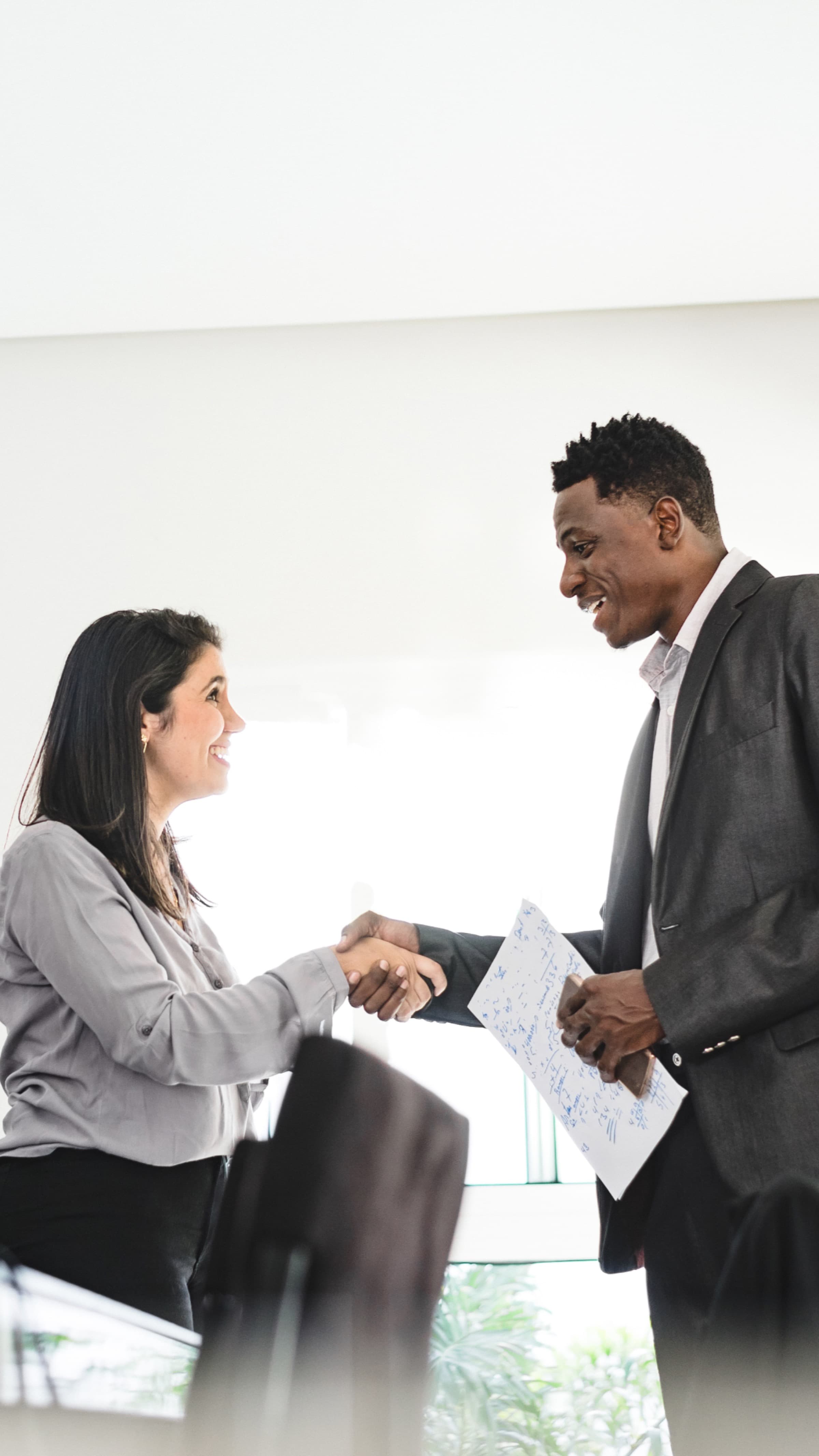 A handshake closing a real estate transaction