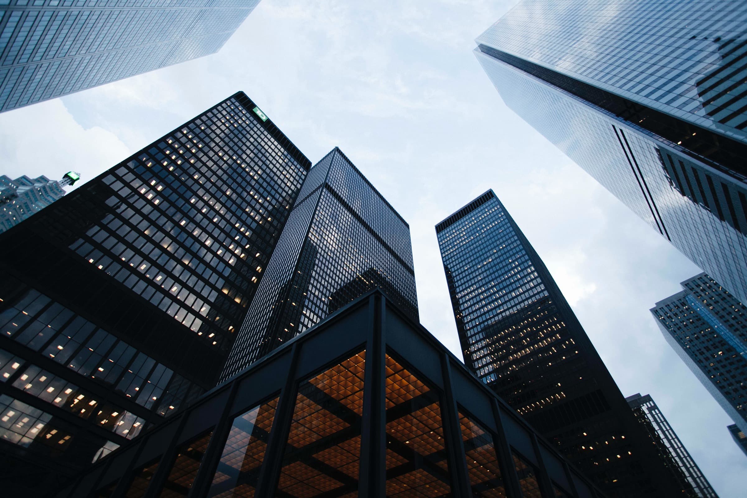 Glass towers rising over a financial district